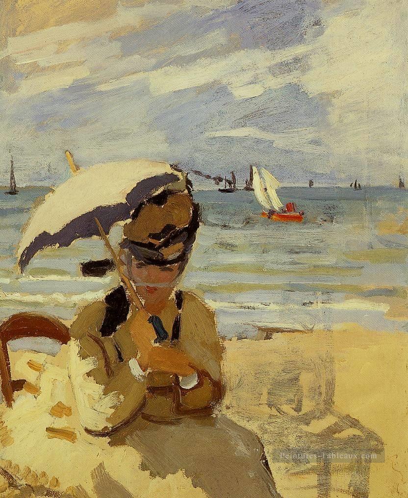Camille Assis sur la plage à Trouville Claude Monet Peintures à l'huile